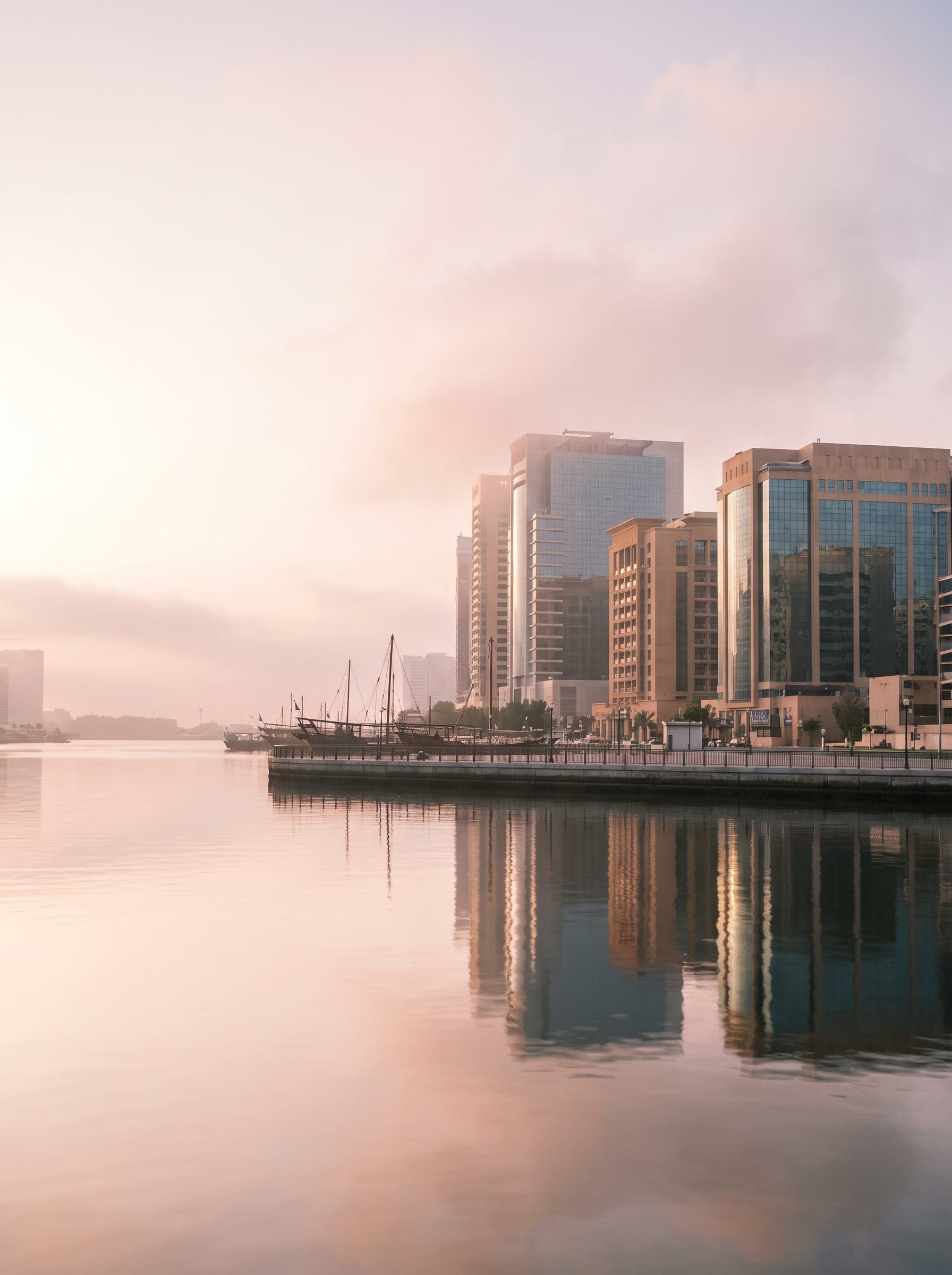 Dubai skyline across the water at dawn