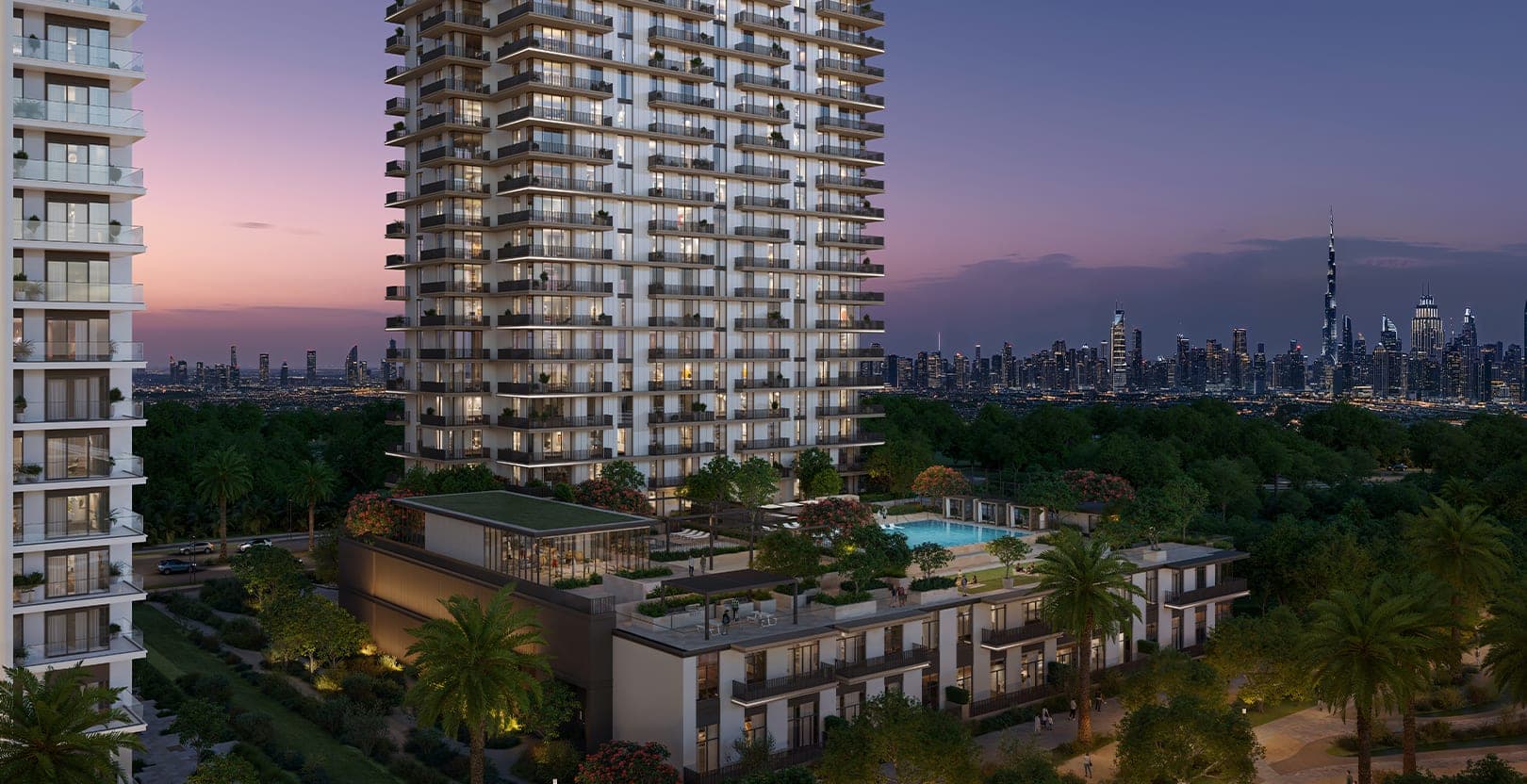 Render of Greencrest at Dubai Hills Estate at dusk, the apartment tower above a landscaped podium pool with the Downtown Dubai skyline in the distance