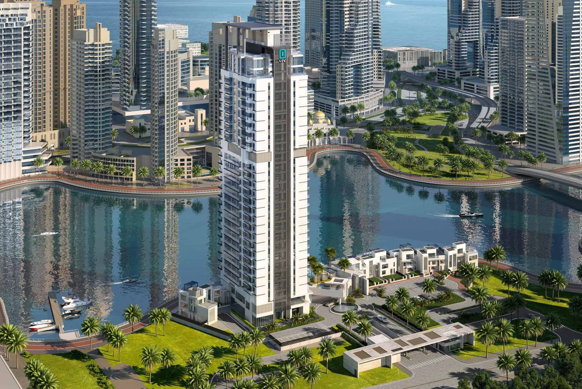 Render of LIV Waterside in Dubai Marina from the air, a white tower with low-rise villas along the marina water and a gated entrance court