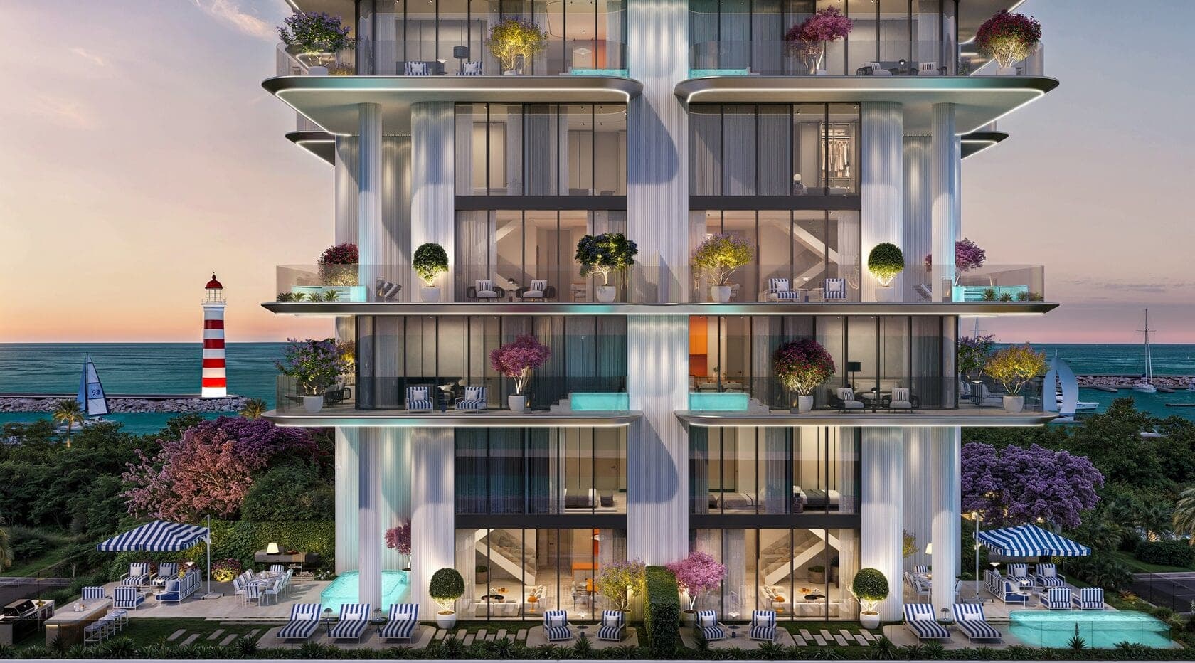 Render of the facade of Villa dell'Arte on Dubai Islands at dusk, fluted columns and cantilevered terraces with plunge pools above a garden of striped loungers, a lighthouse and the sea beyond